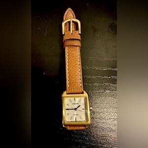 Citizen watch gold plated with genuine leather band.